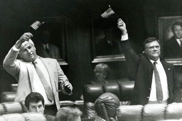 Rep. David Flagg and Rep. F. Allen Boyd do some flag waving on the House floor - Tallahassee, Florida.