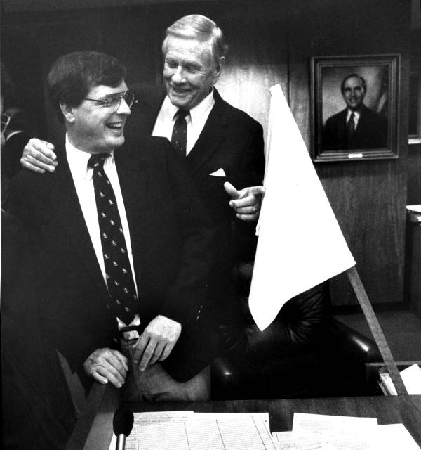Rep. Dale Patchett and Rep Sid Martin laugh at the surrender flag at Patchett's desk - Tallahassee, Florida.