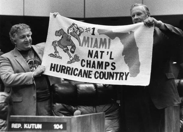 Rep. Barry Kutun and Rep Sid Martin hold a University of Miami National Championship banner - Tallahassee, Florida.