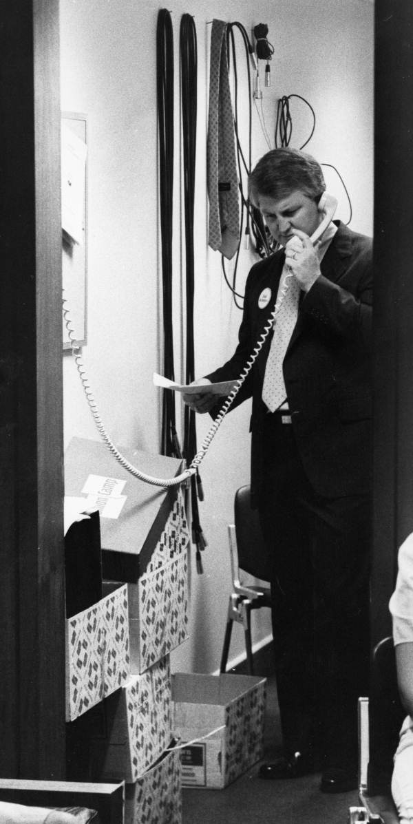 Rep. Bobby Brantley uses the phone in a utility closet - Tallahassee, Florida.