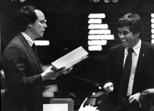 Senator Van Poole tugs on the mike cord of Senator Pat Neal - Tallahassee, Florida.
