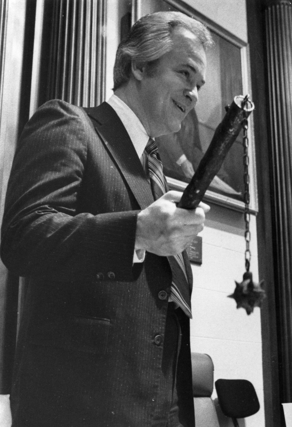 Representative Don Tucker displays a medieval weapon as he presides over the chamber - Tallahassee, Florida.