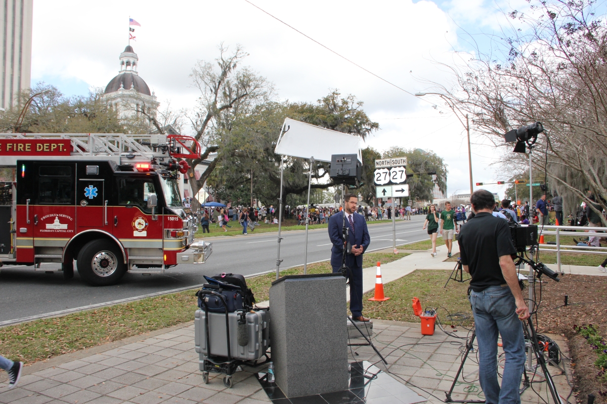 Member of the press covering the Never Again Rally in Tallahassee.