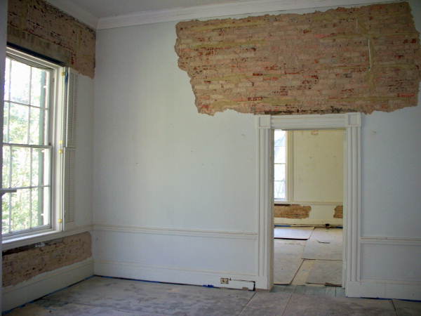 Interior view showing brick walls prepared for restoration at the historic Call-Collins House museum at The Grove in Tallahassee, Florida.