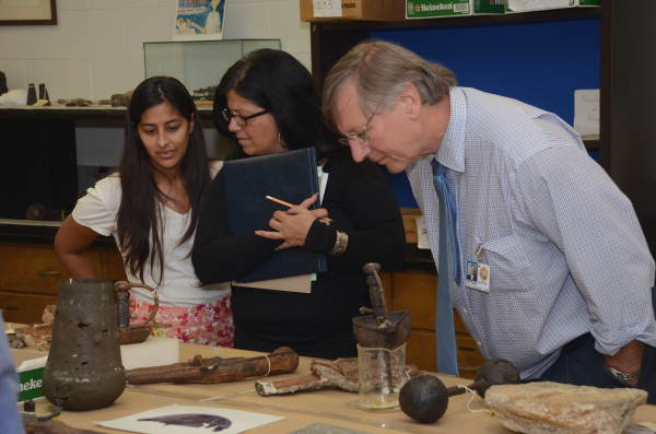 Representatives from the Governor's Office of Policy and Budget (OPB) viewing objects during their visit to the Department of State's Archaeology Conservation lab.
