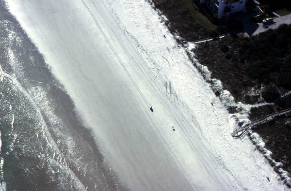 Aerial view showing a section of beach by the Atlantic Ocean between Cocoa Beach and New Smyrna Beach