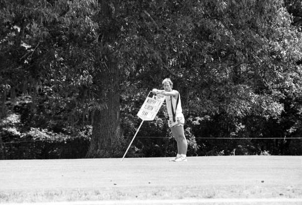 Man working at the Tallahassee Open Invitational - Tallahassee, Florida.