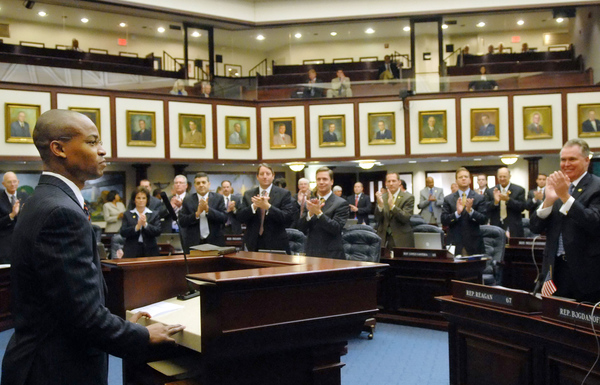Representative Mackenson "Mack" Bernard, D-West Palm Beach, receiving applause after addressing his colleagues on the House floor during a special session of the Legislature in Tallahassee, Florida.