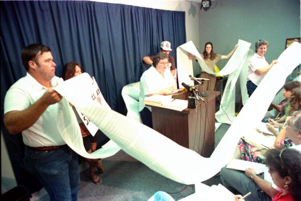 Kerry Dressler shows a computer list of 10,000 sources of toxic waste - Tallahassee, Florida