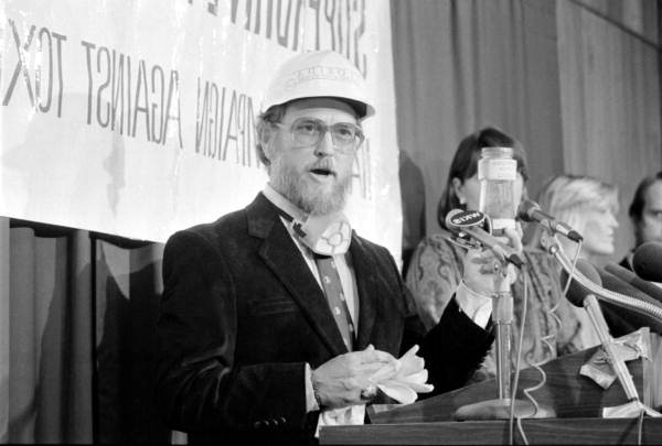 Reverend Mike Young holds a jar of the chemicals from a Superfund site - Tallahassee, Florida
