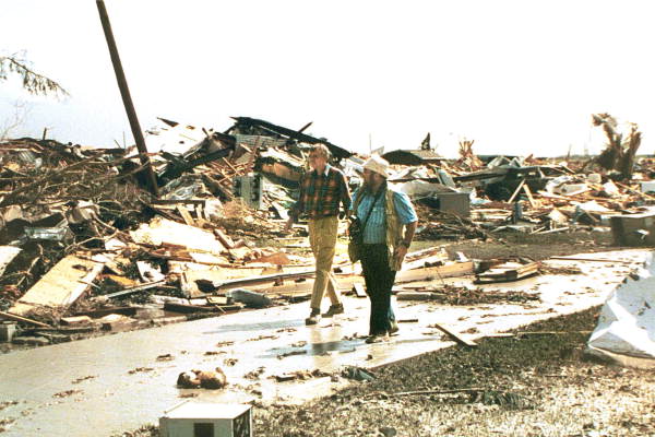 Photographer Mark Foley walking with Governor Chiles following Hurricane Andrew