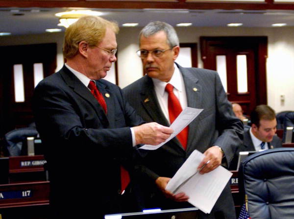 Rep. Mike Davis, R-Naples, right, and Rep. David Mealor, R-Lake Mary, confer on the House floor during the 2003 Legislature..