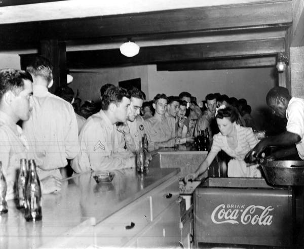 Servicemen being served cokes at the counter in the Gainesville Recreation Dept.'s Service Center.