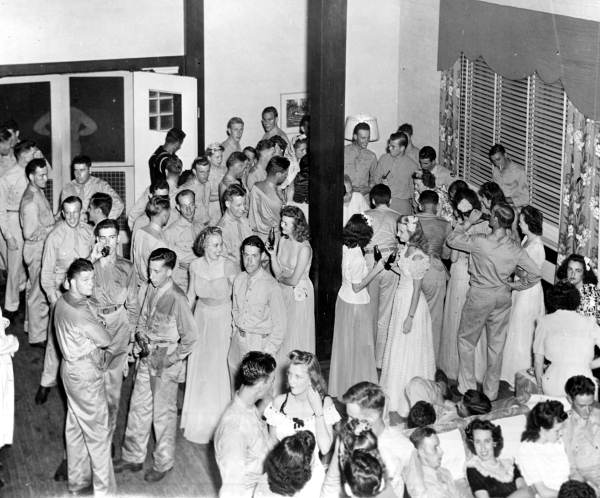 View showing servicemen with women at the Gainesville Recreation Department's Service Center.