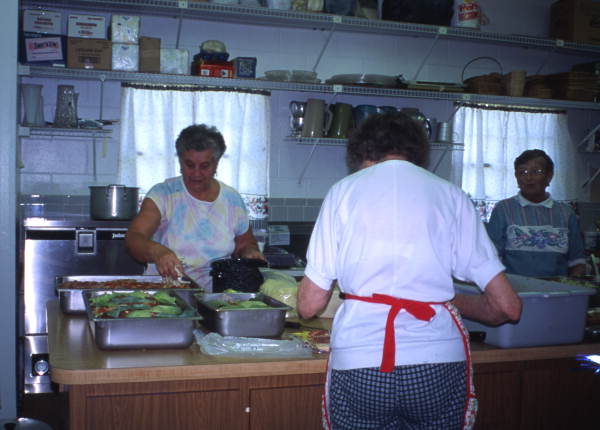 View showing women at a Masaryktown church preparing Czech and Slovak food for an upcoming festival.