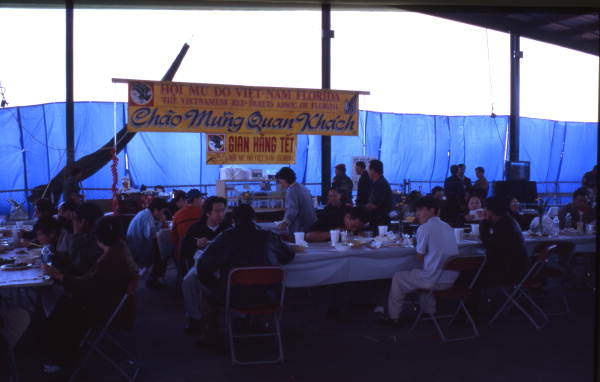 People eating at the Central Florida Fairgrounds during a Vietnamese New Year celebration in Orlando, Florida.