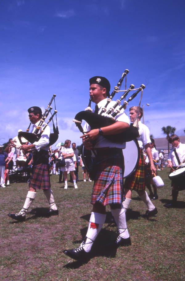 Close-up view showing members of a Scottish pipe band during their performance at the Highland Games in Dunedin, Florida.