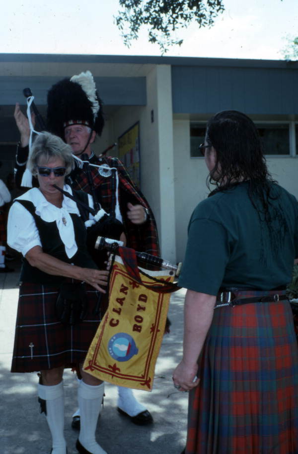 View showing Scottish bagpipe players preparing to perform at the Highland Games in Dunedin, Florida.