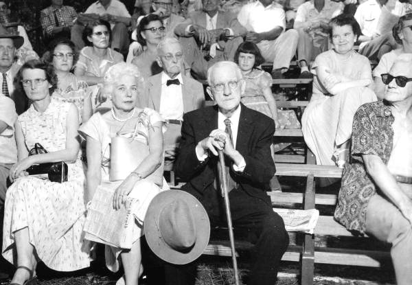 Ex-Governor Hardee and Mrs. Mark Wilcox sitting in the Folk Festival crowd- White Springs, Florida