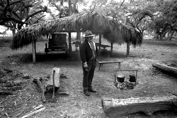 Man standing in the ranching area at the Kissimmee Cow Camp- Frostproof, Florida