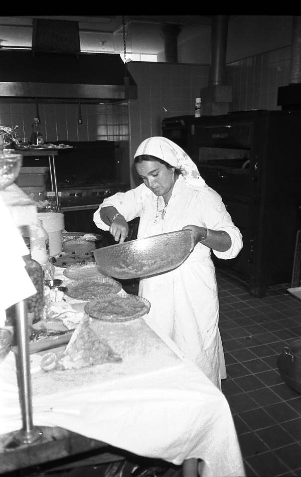 Rina Kramer preparing eggplant dip for a bar mitzvah - Miami Beach, Florida.