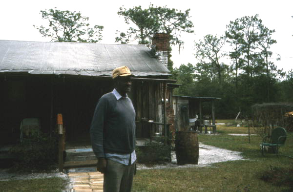 Unidentified man standing in front of home