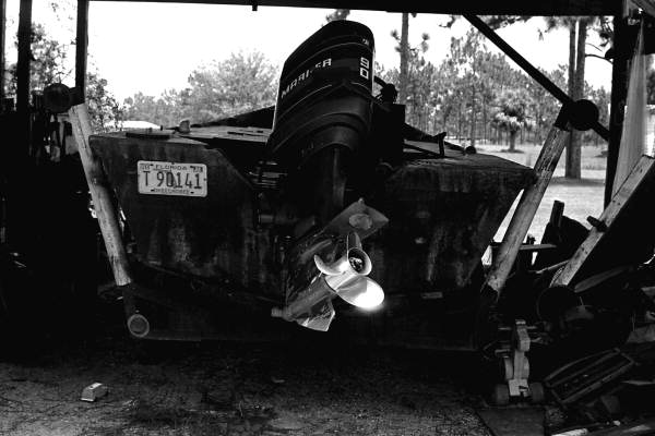 Close-up view of motor on a boat built by Leo Gillis- Basinger, Florida.