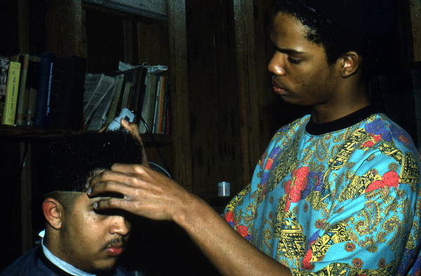 Isaac Moore getting his hair cut and styled by Teddrick Moore- White Springs, Florida