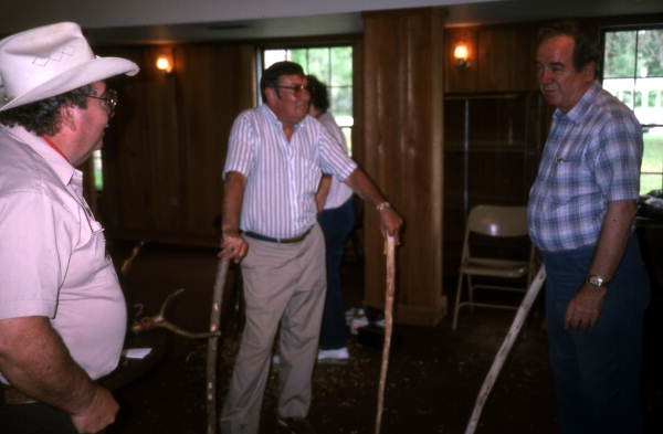 Bobby Johns and students looking at wood carvings they made at Johns' cane making workshop- White Springs, Florida
