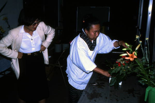 Sumino McGlamory (L) observes as Atsuko Lefcourte makes Ikebana floral arrangement- Lake Park, Florida.