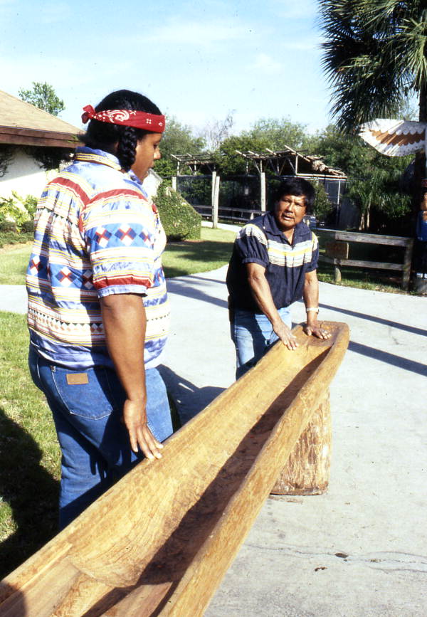 Danny Wilcox (L) and Bobby Henry standing with a dugout canoe- Tampa, Florida