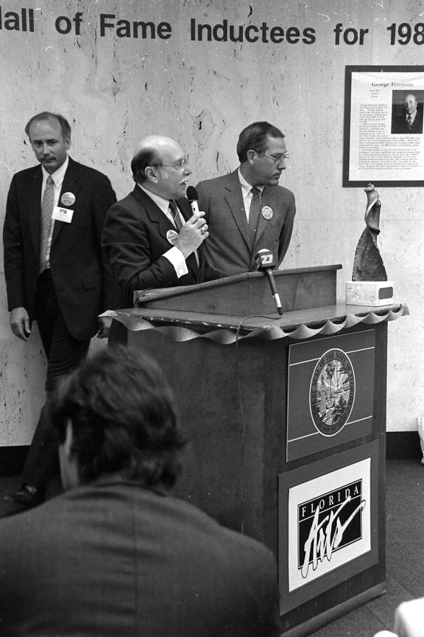 Florida Secretary of State Jim Smith (far right) listens as former Secretary of State George Firestone speaks after receiving a Florida Artists Hall of Fame award - Tallahassee, Florida.