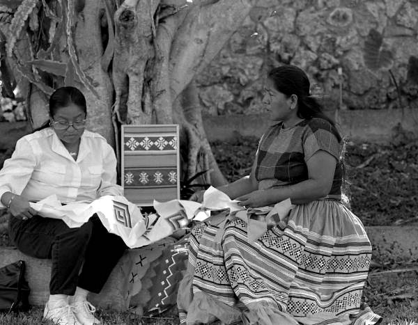 Miccosukee Indian Jennie Billie teaching apprentice Minnie Bert how to make Seminole/Miccosukee patchwork - Miccosukee Reservation, Florida