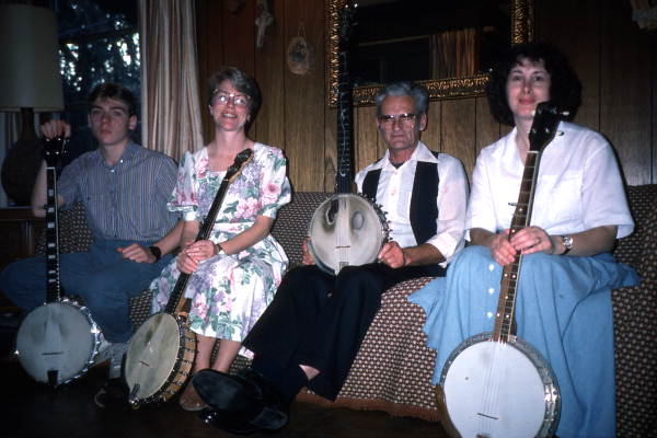 Group portrait of banjo player Dale Webber and apprentices Jason Pennypacker, Linda Fackeldey, and Melanie Robertson- Odessa, Florida