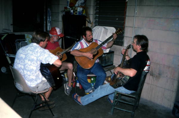 Blues guitarist Tampa Blue teaching apprentices Michael Dodge, Joseph Reina, and David Kirby how to play the blues- Tampa, Florida.