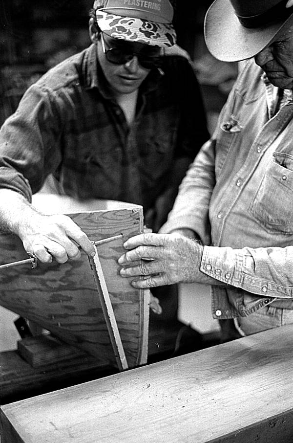 Glen Simmons and apprentice Donald Edwards building an Everglades skiff- Florida City, Florida.