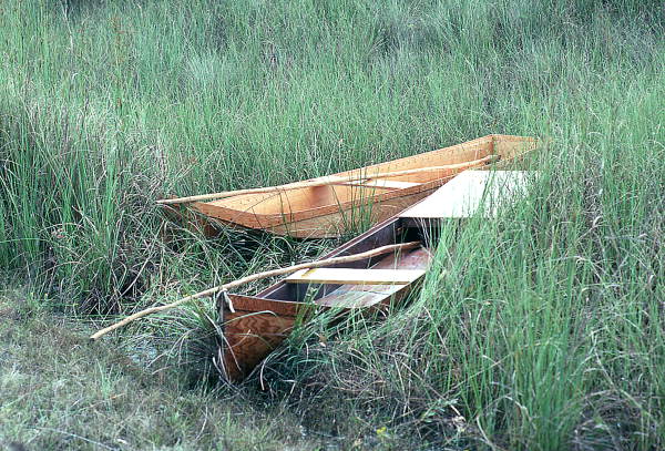 Glades skiffs made by Glen Simmons sitting in the water- Florida City, Florida