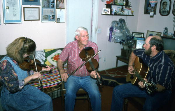 Apprentice Trenda Slaughter and fiddler Willie David Jones playing music with unidentified guitarist - Old Town, Florida