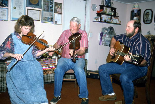 Apprentice Trenda Slaughter and fiddler Willie David Jones playing music with unidentified guitarist - Old Town, Florida