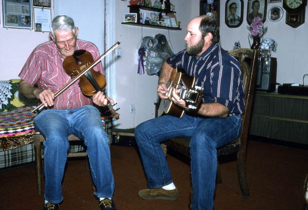 Oldtime fiddler Willie David Jones playing music with unidentified guitarist - Old Town, Florida