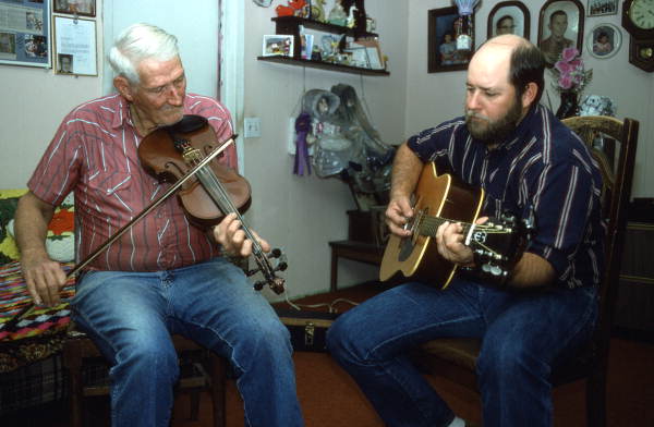Oldtime fiddler Willie David Jones playing music with unidentified guitarist - Old Town, Florida