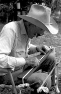 Cow whip maker George "Junior" Mills at work - Okeechobee, Florida.
