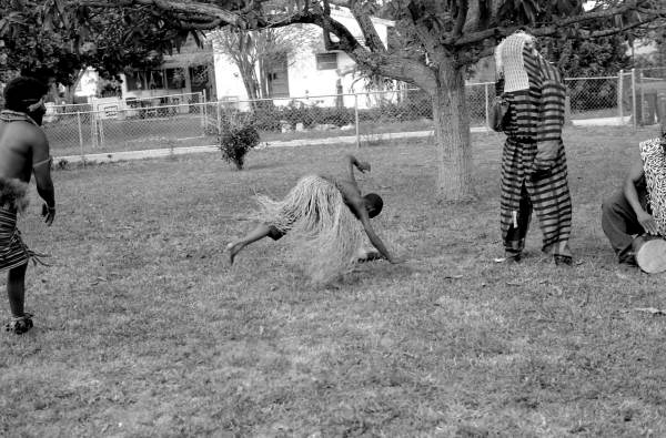 Nigerian acrobatic dance apprentice Akila Baki practicing - North Miami, Florida.