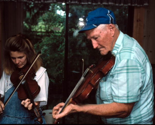 Willie David Jones teaching Trenda Slaughter how to play oldtime fiddle music - Old Town, Florida