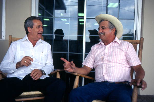 Cuban guajiro apprentice, Mario Brito, left, sings a decima to Meliton Perdomo - Medley, Florida