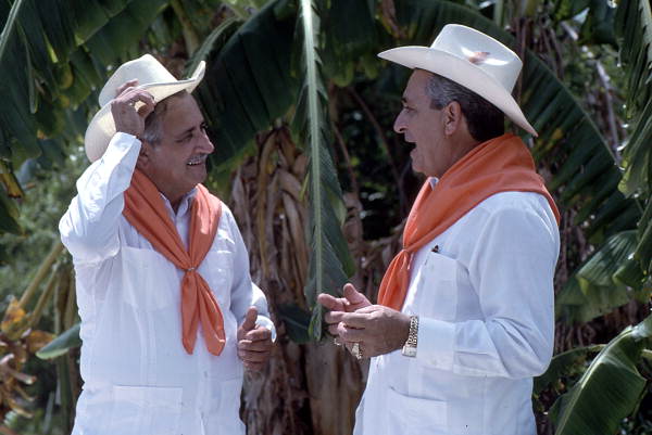 Cuban guajiro apprentice, Mario Brito, right, sings a decima to Meliton Perdomo - Medley, Florida