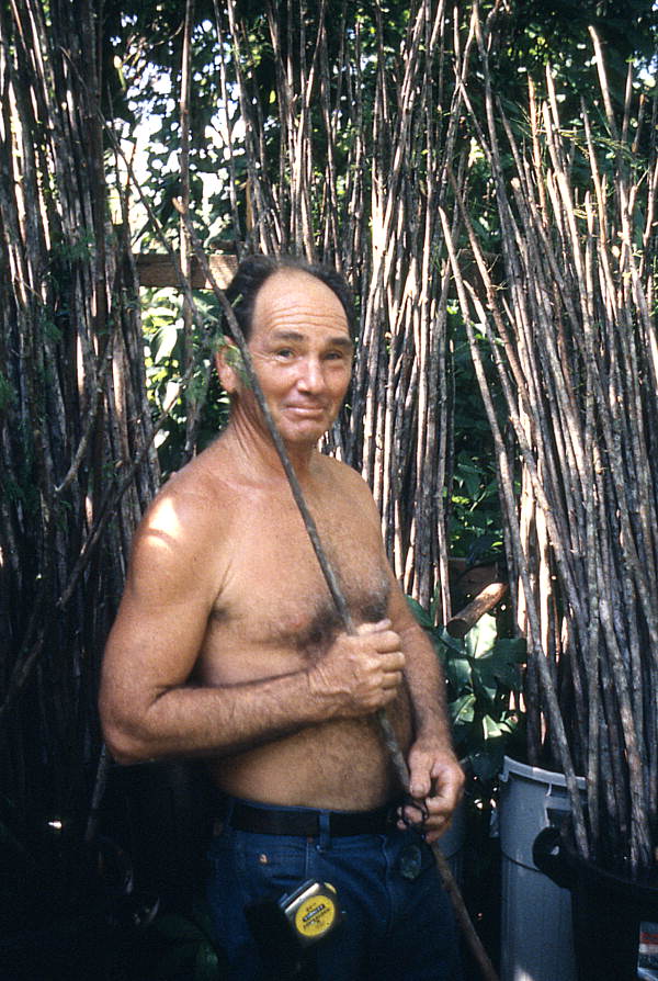Furniture maker Robert James Rudd holding a piece of cypress - Lake Worth, Florida.