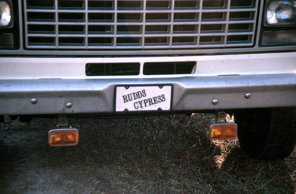 Tag on the front of cypress furniture maker's truck - Bronson, Florida