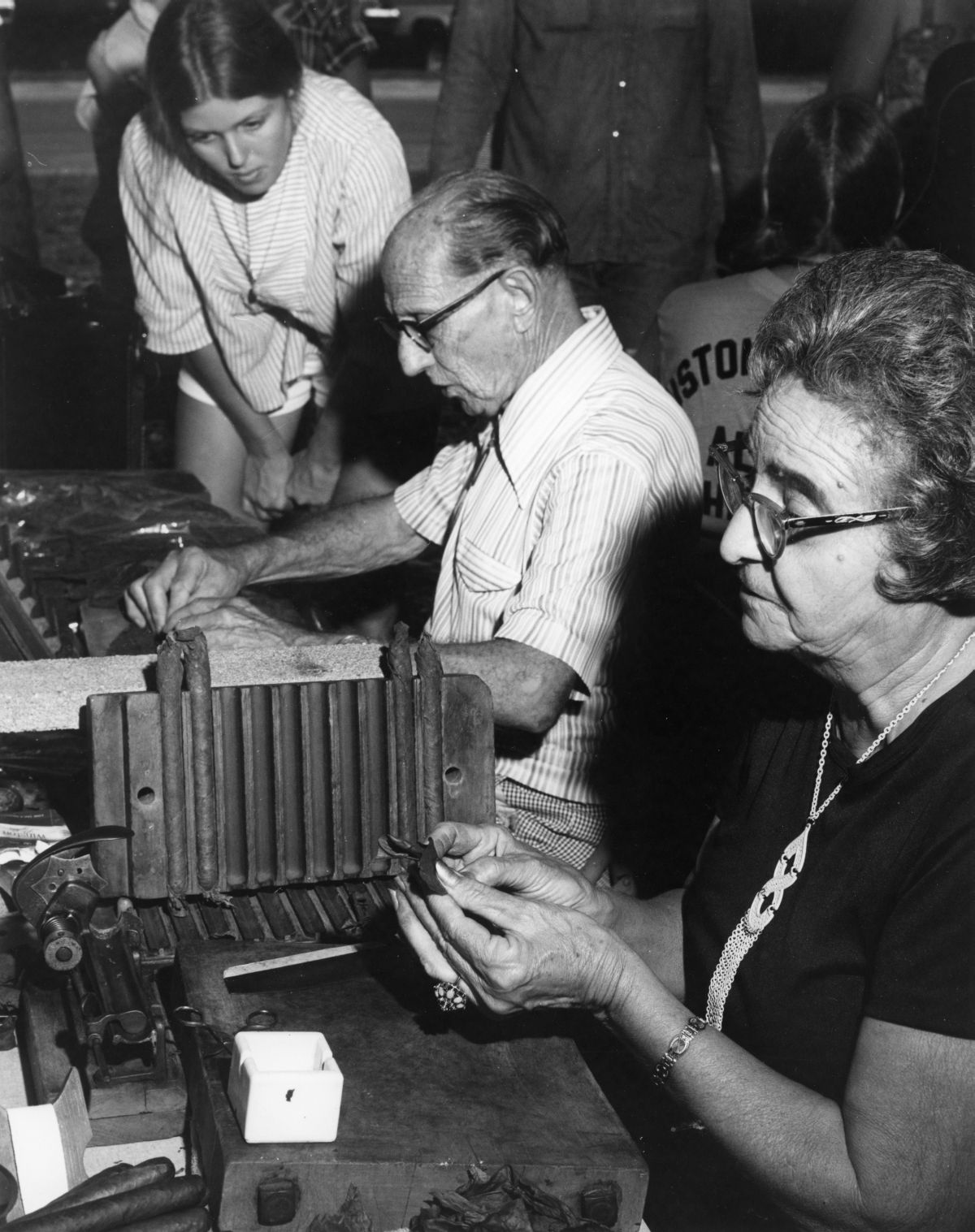 Faustino and Consuelo Fernandez of Tampa demonstrating cigar rolling at the 1977 Florida Folk Festival - White Springs, Florida.