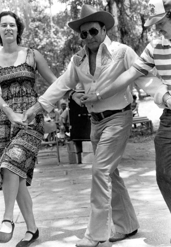 Secretary of State George Firestone dancing with the Drava Folkdance Ensemble at the 1980 Florida Folk Festival.